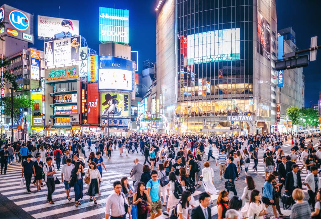 Shibuya crossing at night in Tokyo