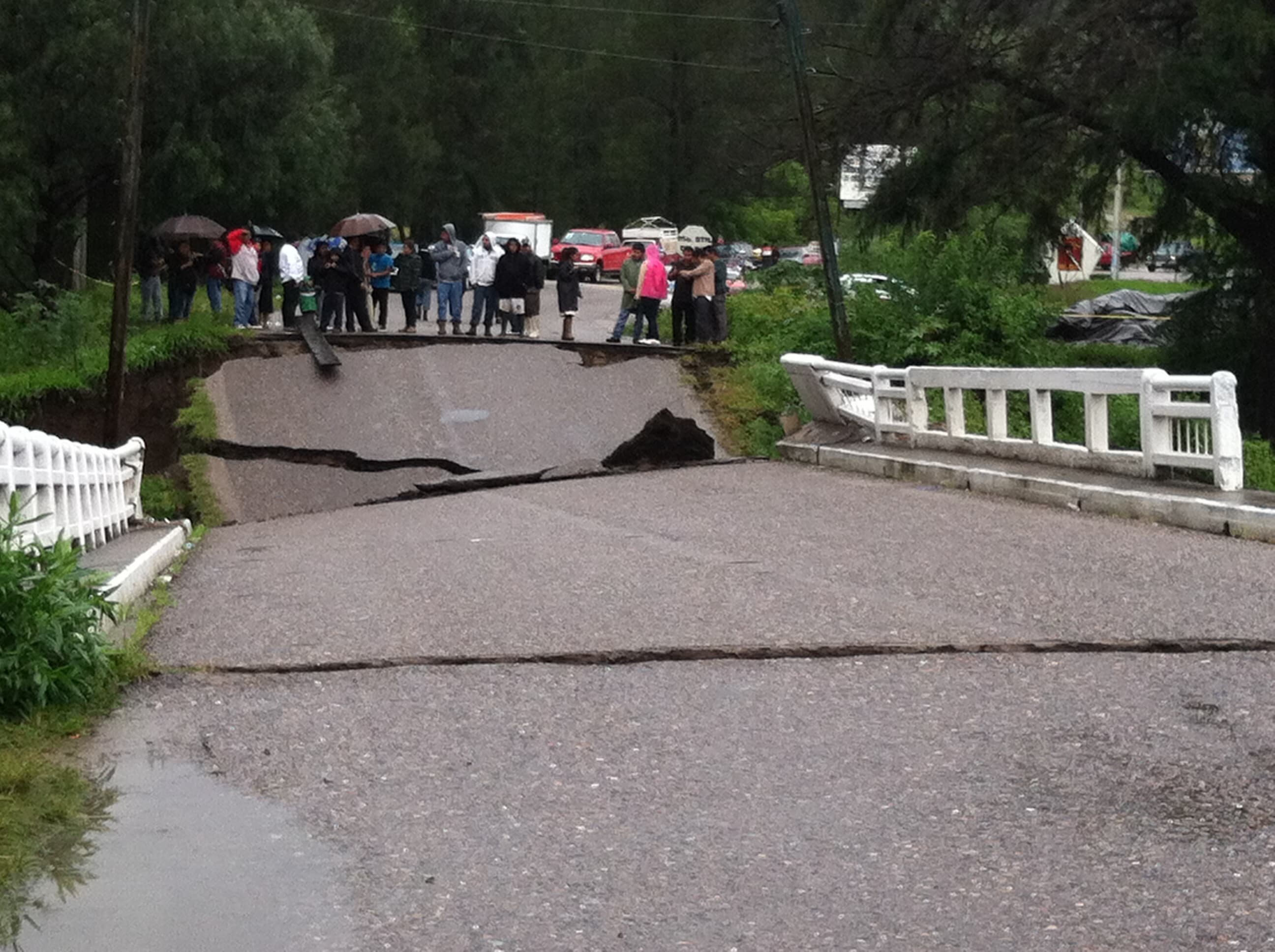 Collapsed roadway stretch in Oaxaca after storm damage
